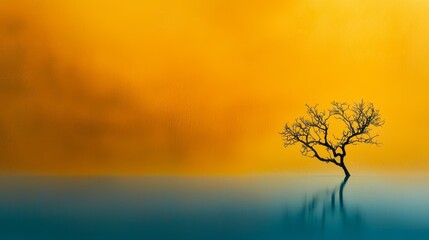 Fototapeta premium A lone tree painted in the center of a water body, surrounded by a yellow sky background