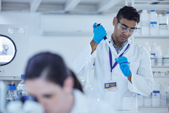 Healthcare, science and man in laboratory with illness sample for research, medical study or forensic investigation. Science, pharmaceutical and scientist with pathology test or biology exam