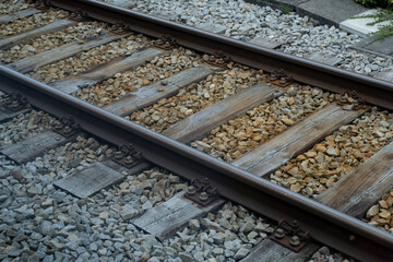 outdoor train rails with wood and stones