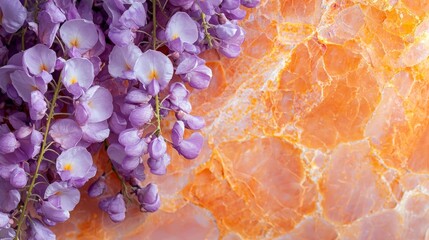  Purple flowers atop an orange-yellow marble slab against an orange backdrop