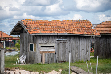 Travelling in France, old wooden huts and oysters farms in Gujan-Mestras village, cultivation and sale of fresh oysters seashells, Arcachon bay, Atlantic ocean, France, tourists destination
