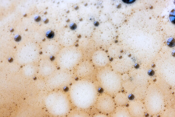 Close-up view of coffee texture, espresso shot from top view.
