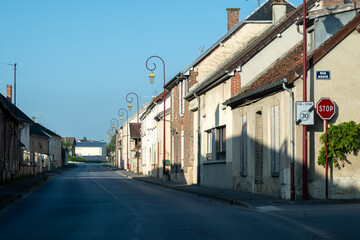 Driving in Champagne wine making region in Champagne, France. Streets, houses, road signes and places of destinations in summer