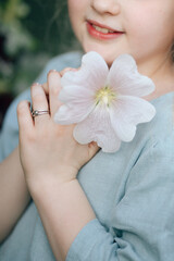 A girl in the mallow flower garden