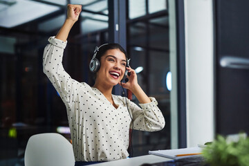 Woman, call center and smile with celebration, fist and bonus for telemarketing at night in office....