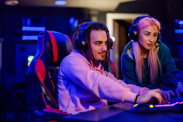 Professional gamer is practicing for esport tournament in gaming lounge