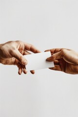 A person holding out a piece of paper to someone else, possibly a transaction or exchange