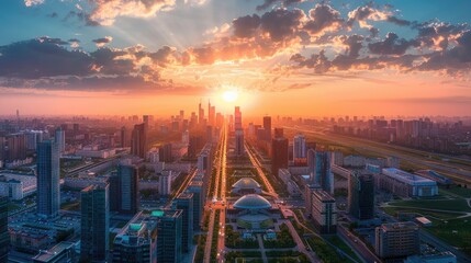 Fototapeta premium Aerial view of a city during sunset, with buildings and skyscrapers lit up by the golden light