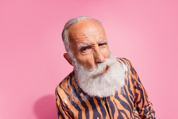 Photo of funny grandfather confused face eavesdrop tiger print shirt isolated on pink color...