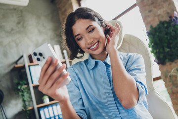 Photo of positive good mood lady specialist dressed shirt recording video modern gadget indoors...