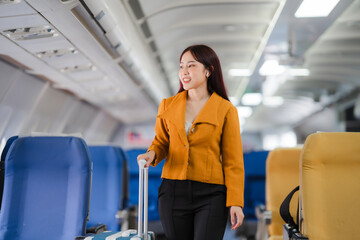 Businesswoman in Flight: A young woman in a stylish yellow blazer confidently walks down the aisle of an airplane, radiating a sense of purpose and anticipation for her upcoming journey.  