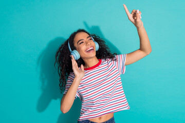 Photo portrait of lovely young lady enjoy music headphones dressed stylish striped garment isolated...