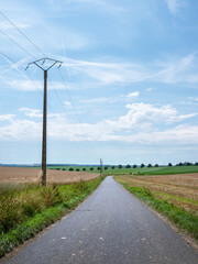 country road in rural countryside of pays de laon in aisne area of france