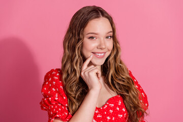 Photo portrait of attractive teen woman look minded curious camera dressed stylish red clothes isolated on pink color background