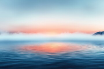 Obraz premium A tranquil scene of a foggy river at sunrise, reflecting soft colors on the water for a serene atmosphere.