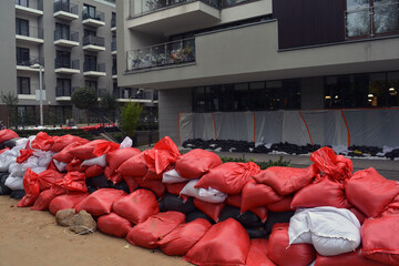 Bags of walking next to the house. Flood protection. Threat of flooding by the river. Wroclaw, Poland September 2024