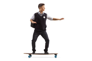 Male student riding a skateboard
