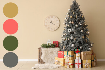 Christmas tree with presents near light wall in room