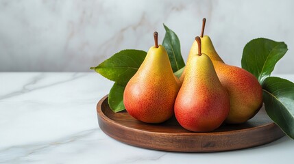 Vibrant Arrangement of Three Ripe Forelle Pears with Green Leaves on a Rustic Wooden Tray Against a Chic White Marble Background&mdash;A Celebration of Healthy Eating