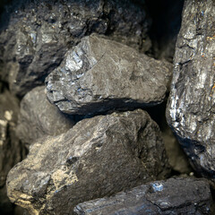 Coal in close-up. solid fuel is a useful fossil fuel for heating housing. Environmental concept, air pollution, coal energy