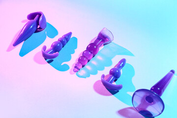 Anal plugs from sex shop on color background