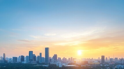 Obraz premium Silhouette of cityscape at sunset with bright orange sky.