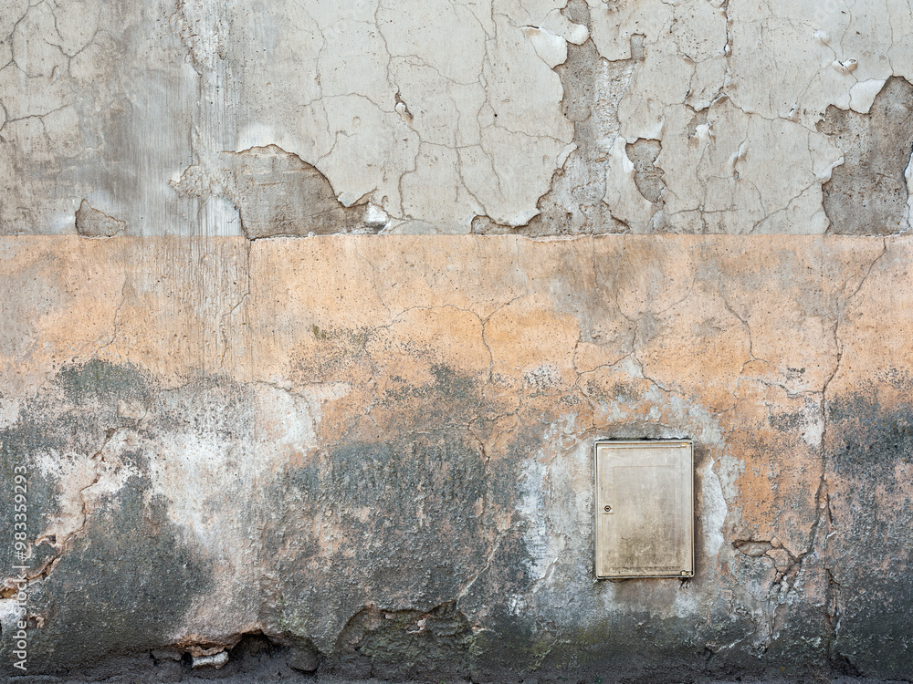 Wall mural wall of old french house with yellow faded stucco and cracks