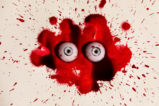 Spooky eyeball toys in a fake blood splatter pattern