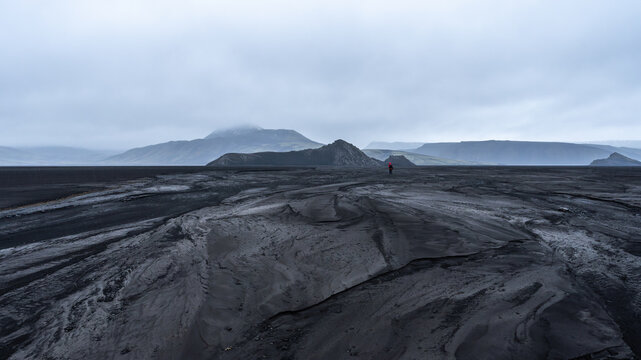Moody Icelandic highlands with solitary figure