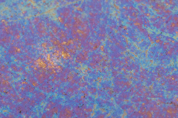 Vibrant colors and intricate textures in a water puddle