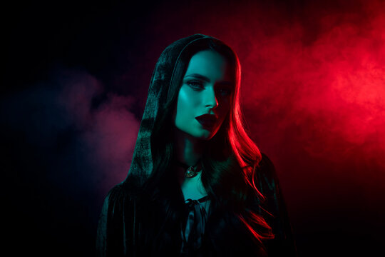 Photo of dangerous scary lady dressed sorcerer outfit look tempting isolated red light neon mist color background