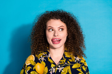 Photo of dreamy attractive lady dressed print shirt stick out looking empty space isolated blue...