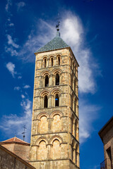 Romanesque tower of the church of San Esteban (12th century), in Plaza de San Esteban in Segovia, Castilla y Leon, Spain, perspective view with intense blue sky