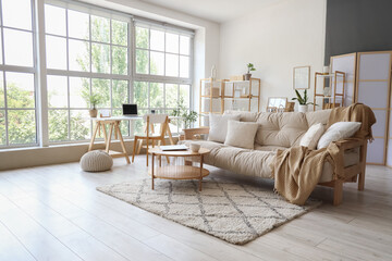 Interior of modern light living room with sofa and table