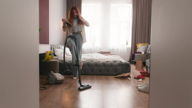 Home cleaning multitasking busy hurry woman lady female housewife businesswoman homeowner housekeeping chore mess in bedroom talking mobile phone stressed anxious girl rush clean house vacuum cleaner