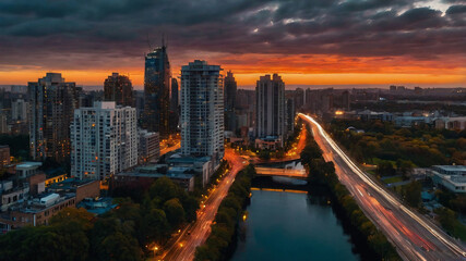 city at sunset ،wide horizon، high-rise buildings،Fast cars ،Clouds