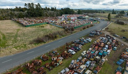 Abandoned and rusted classic cars  in the The historical Horopito Motor Wreckers - Smash Palace,...