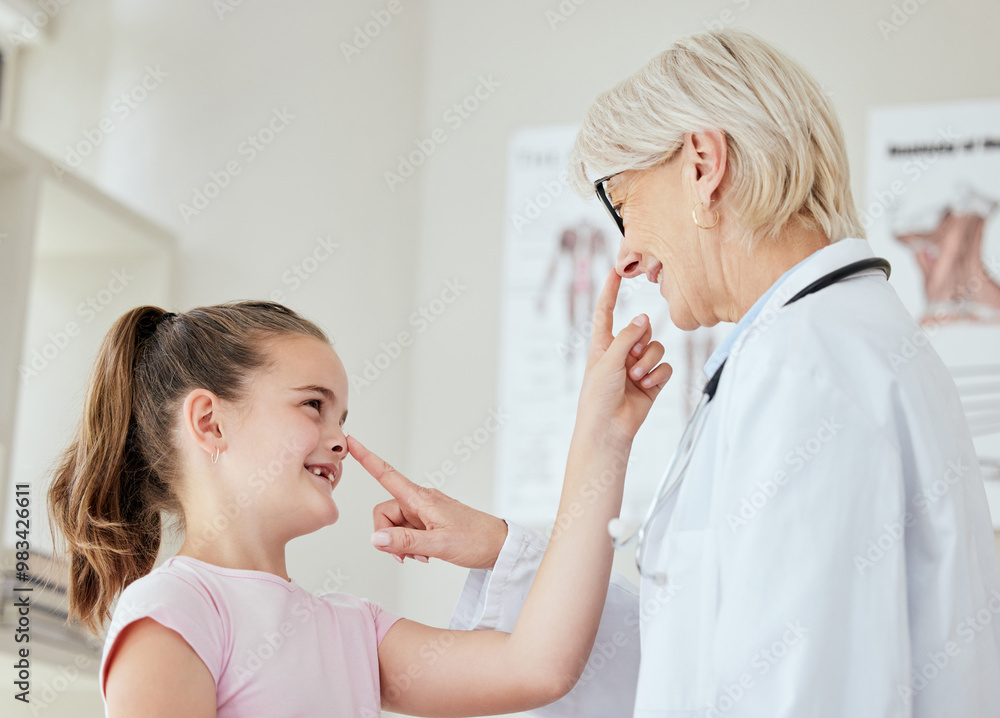 Poster Happy girl, nose and playing with doctor for checkup, diagnosis or quick exam at hospital. Little child, young kid or touch with adorable, cute or medical professional for healthcare test at clinic