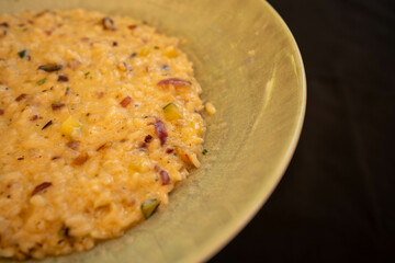 Vegetable risotto with parmesan and butter close-up