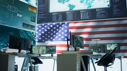 Empty army command center with big data presents the American flag, top secret armed forces agency protecting the country from threats. Monitoring room with high tech gear. Camera B.