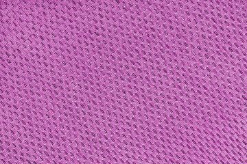 Texture of pink jacquard fabric of diagonal rough weave cloth structure macro background