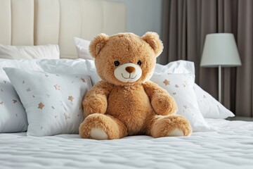 A teddy bear sitting on a bed, surrounded by pillows, symbolizing childhood comfort and sweet memories