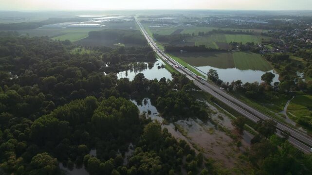 Katy Wroclawskie, Lower Silesia, Poland - September 19 2024: Aerial view of rising rivers threaten southern Poland near Wroclaw, A4 Autostrada Highway, Bystzryca river floods roads and villages