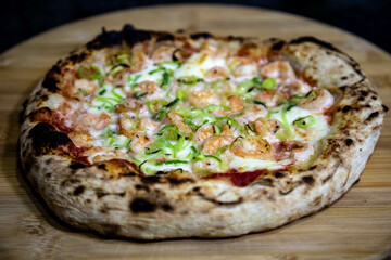 Rustic artisanal shrimp pizza with catupiry cheese and leeks
