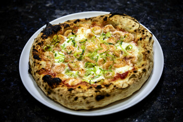 Rustic artisanal shrimp pizza with catupiry cheese and leeks