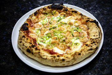 Rustic artisanal shrimp pizza with catupiry cheese and leeks