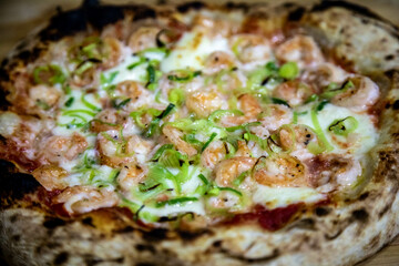 Rustic artisanal shrimp pizza with catupiry cheese and leeks