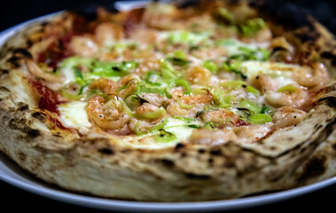 Rustic artisanal shrimp pizza with catupiry cheese and leeks