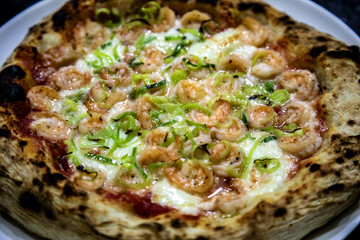 Rustic artisanal shrimp pizza with catupiry cheese and leeks