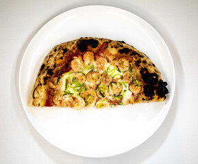 Rustic artisanal shrimp pizza with catupiry cheese and leeks